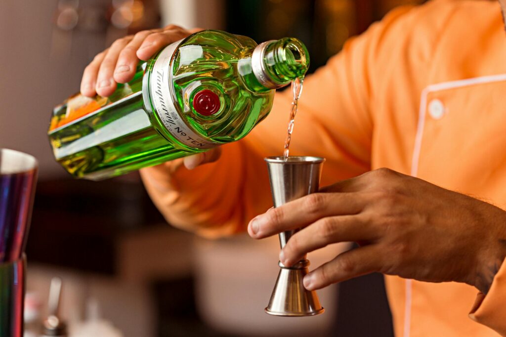 bartender pouring spirit