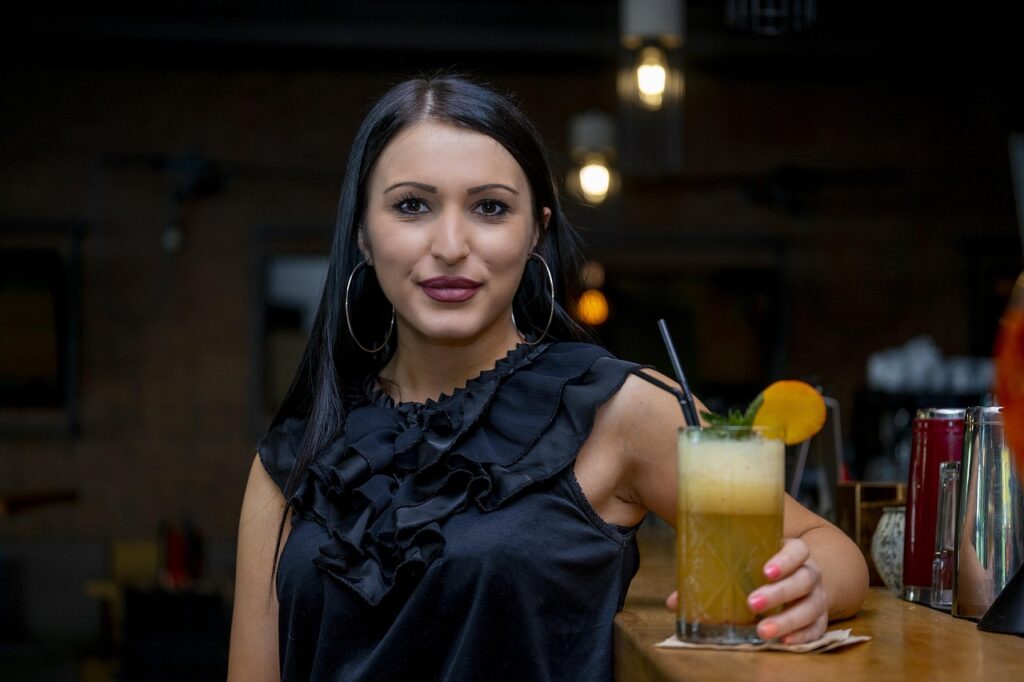 bartender pouring cocktail