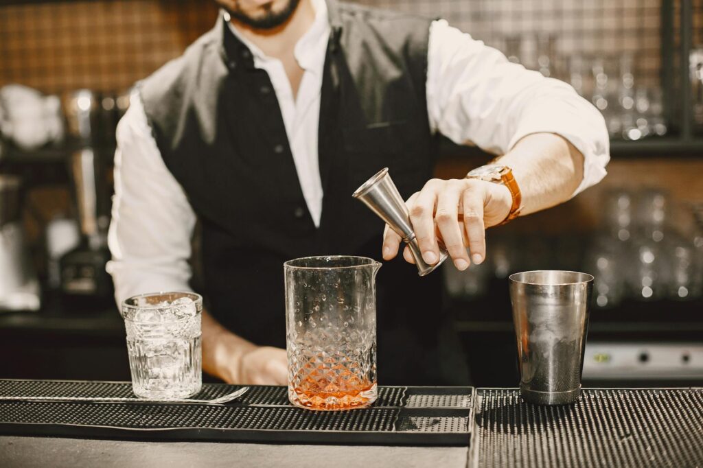 bartender using dado a pourer