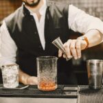 bartender using dado a pourer