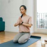 person meditating outdoors