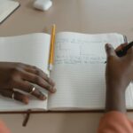 person writing goals