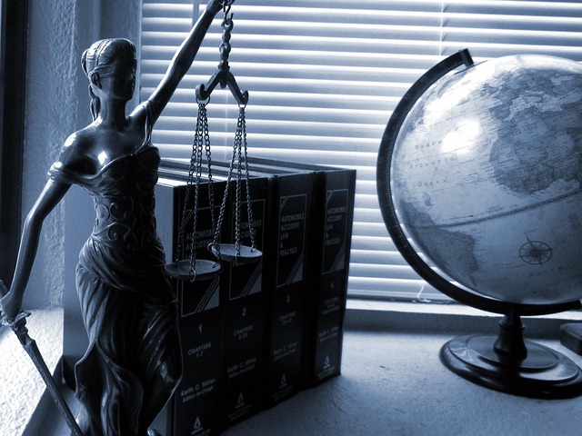 Legal scales of justice with a blurred court document in the background