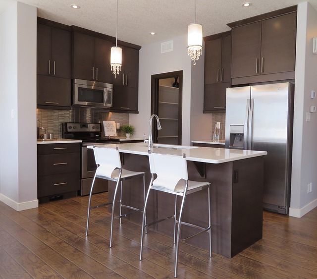 modern pendant light fixture hanging over kitchen island