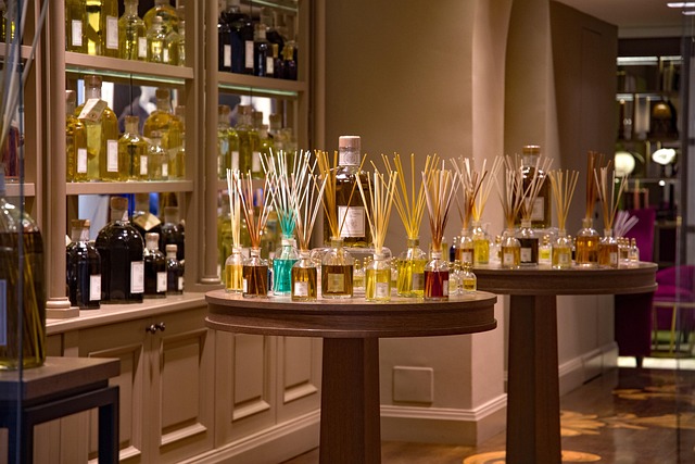 Perfume bottles stored in a dark wooden drawer