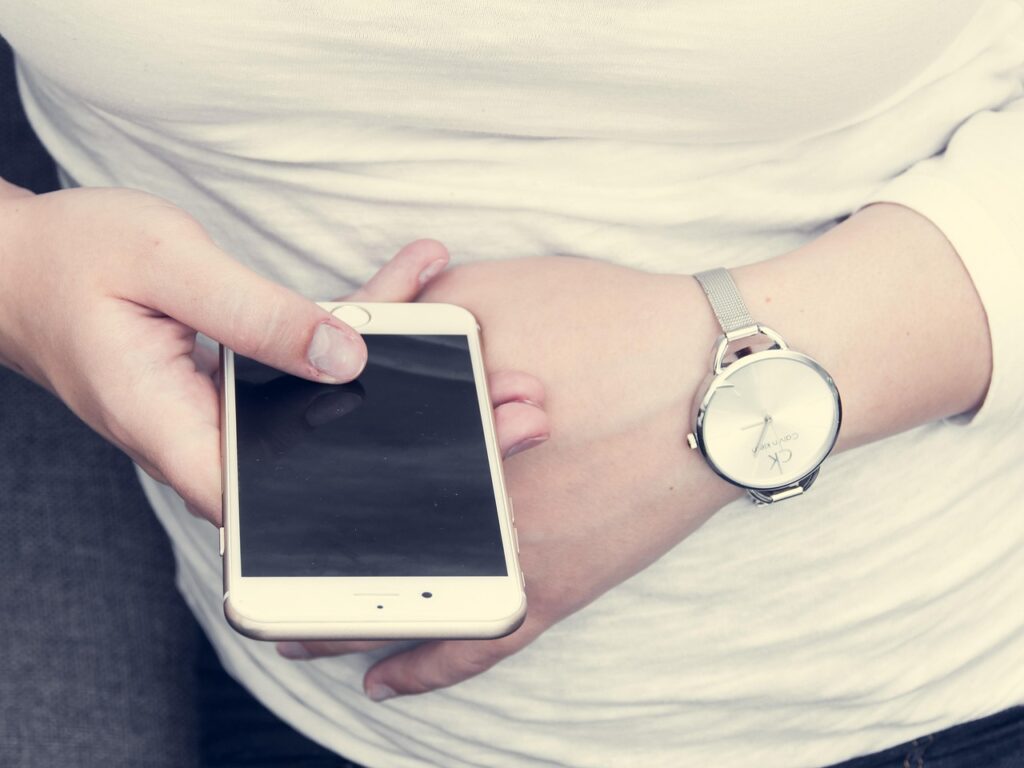 person using recycling app on phone