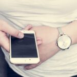 person using recycling app on phone