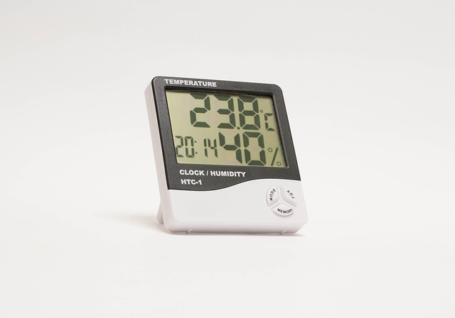 Close-up of a digital hygrometer showing a humidity level of 45% in a home setting