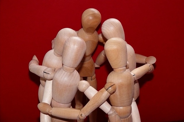 People collaborating in a meeting room, demonstrating good emotional intelligence and teamwork