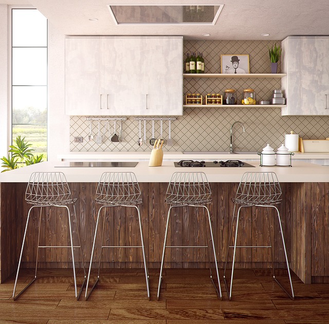 Person installing a tile backsplash in a kitchen, an intermediate DIY project