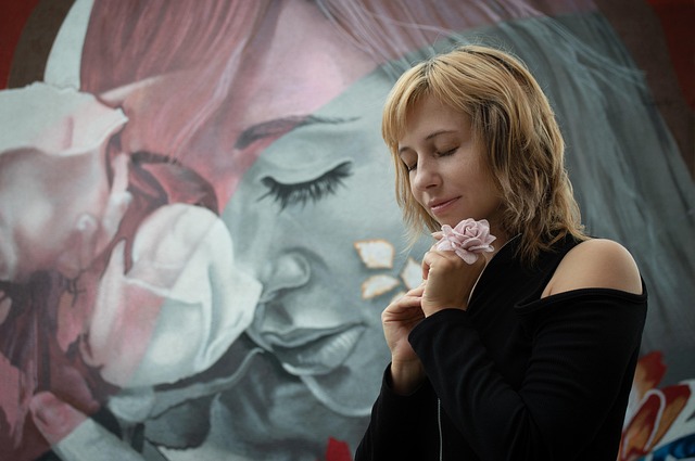 Person painting a wall with a roller, demonstrating DIY home improvement (how to diy home improvement)