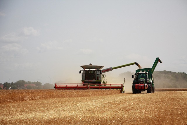 Farmer operating a tractor pulling a message through a field